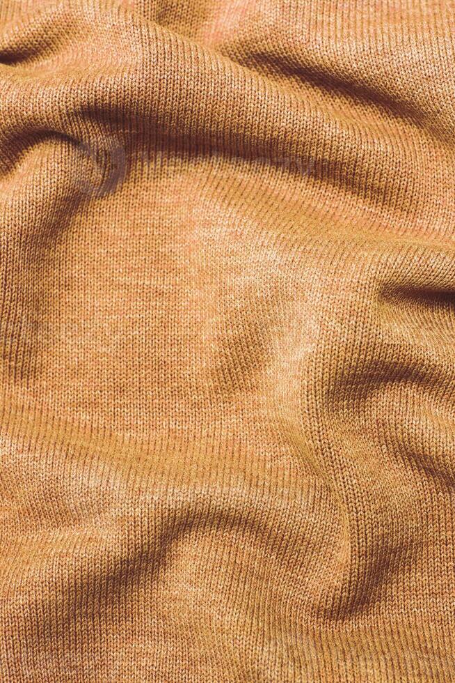 burgundy Peach Fuzz wrinkled plush fabric background texture, soft material pattern photo