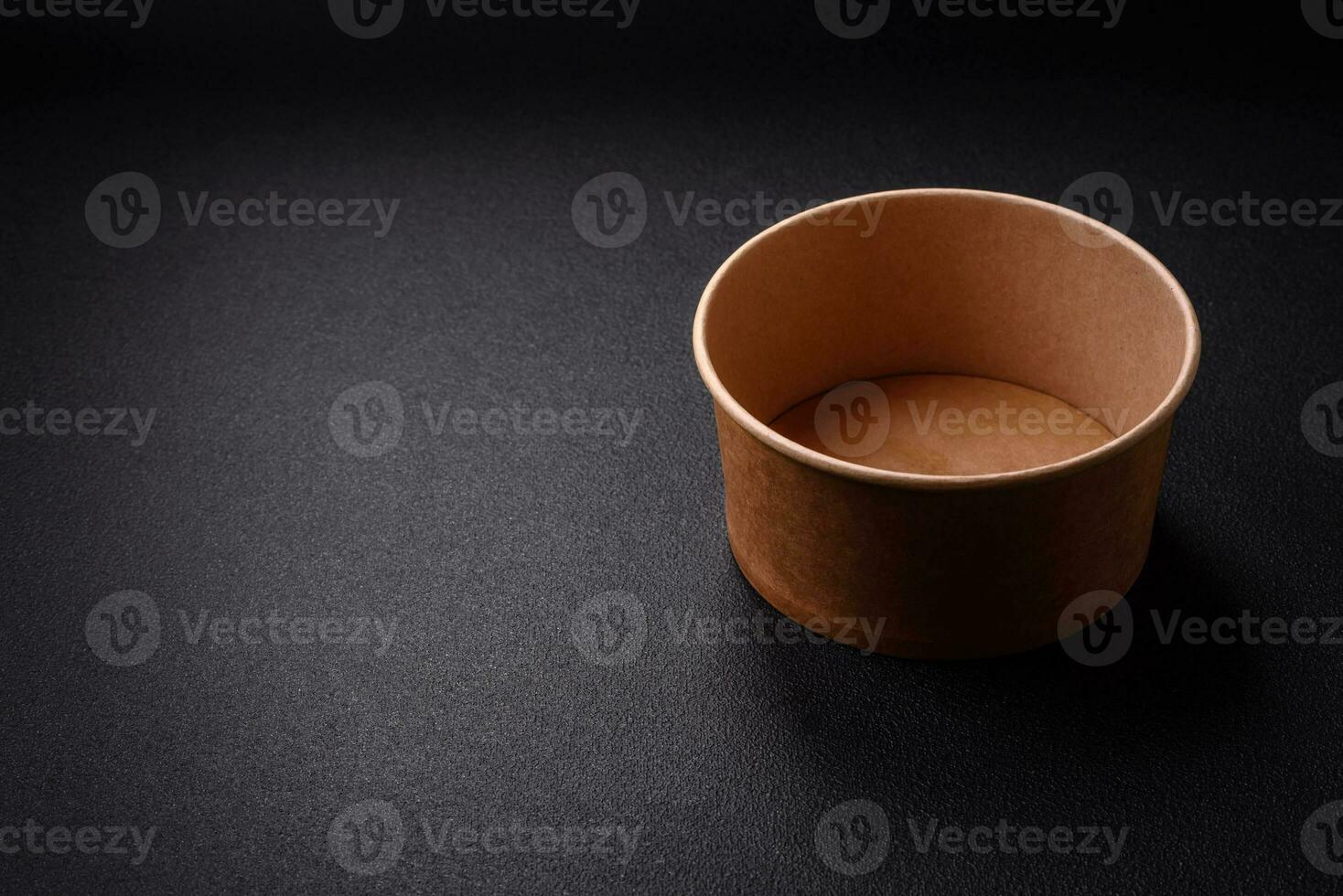 A cylindrical container made from environmentally friendly recycled materials for takeaway food photo