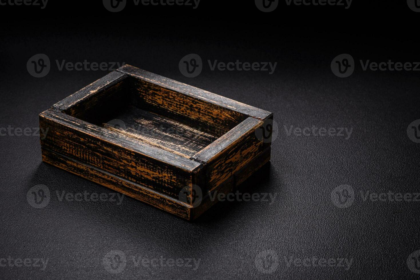 Empty rectangular wooden cutlery box on textured concrete background photo