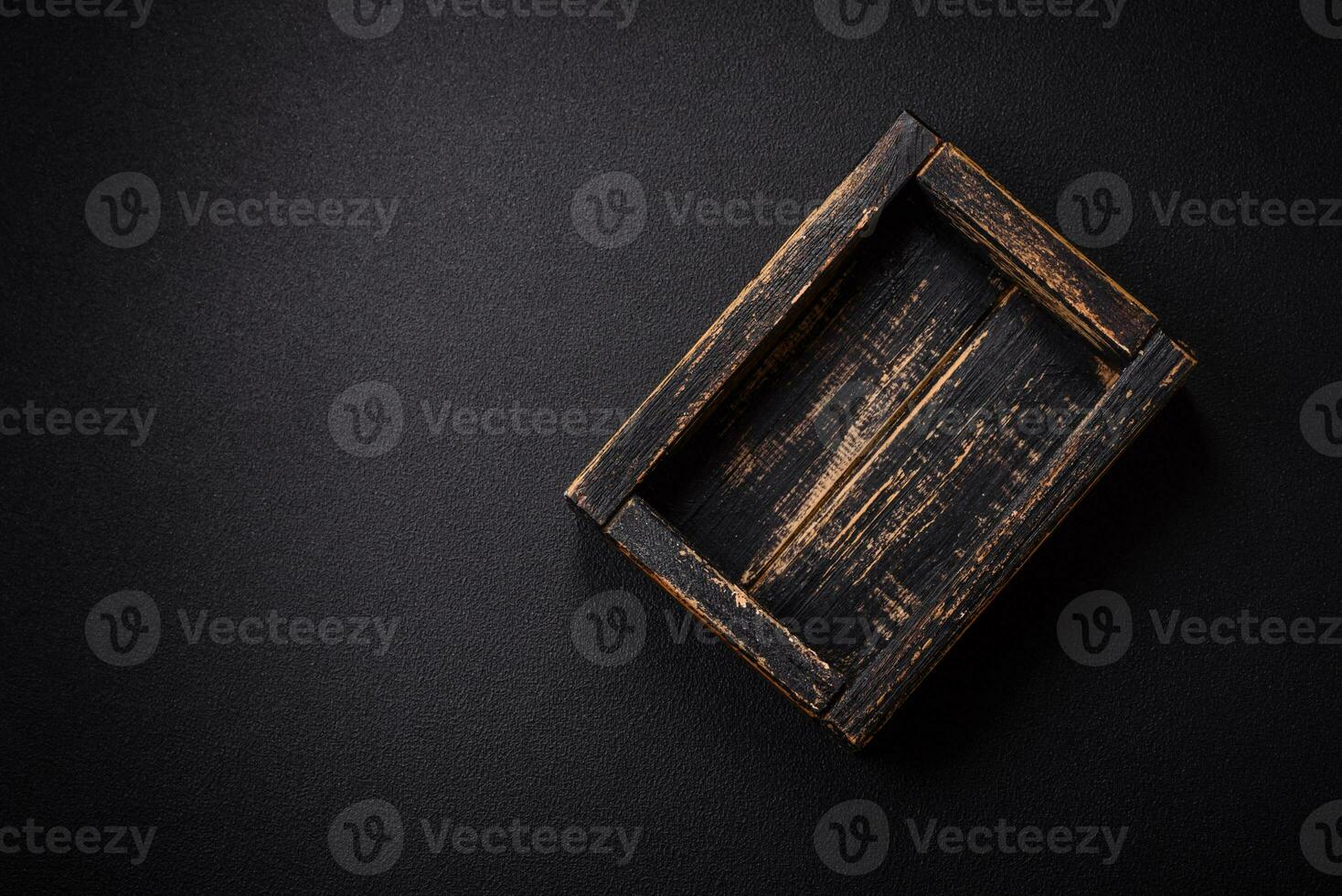 Empty rectangular wooden cutlery box on textured concrete background photo