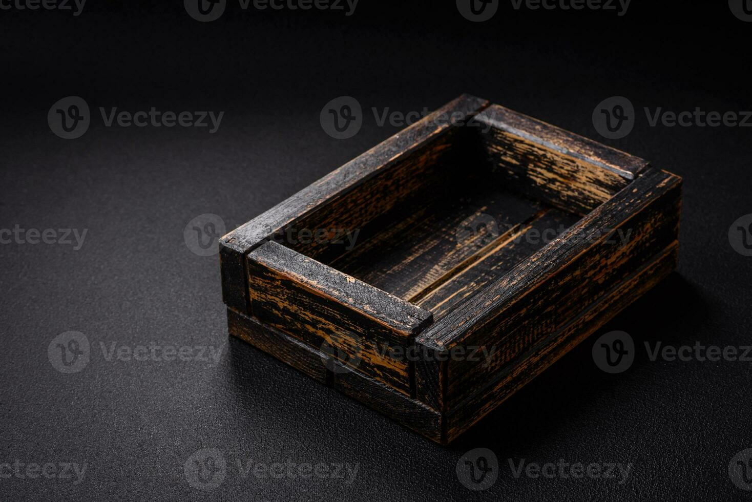 Empty rectangular wooden cutlery box on textured concrete background photo