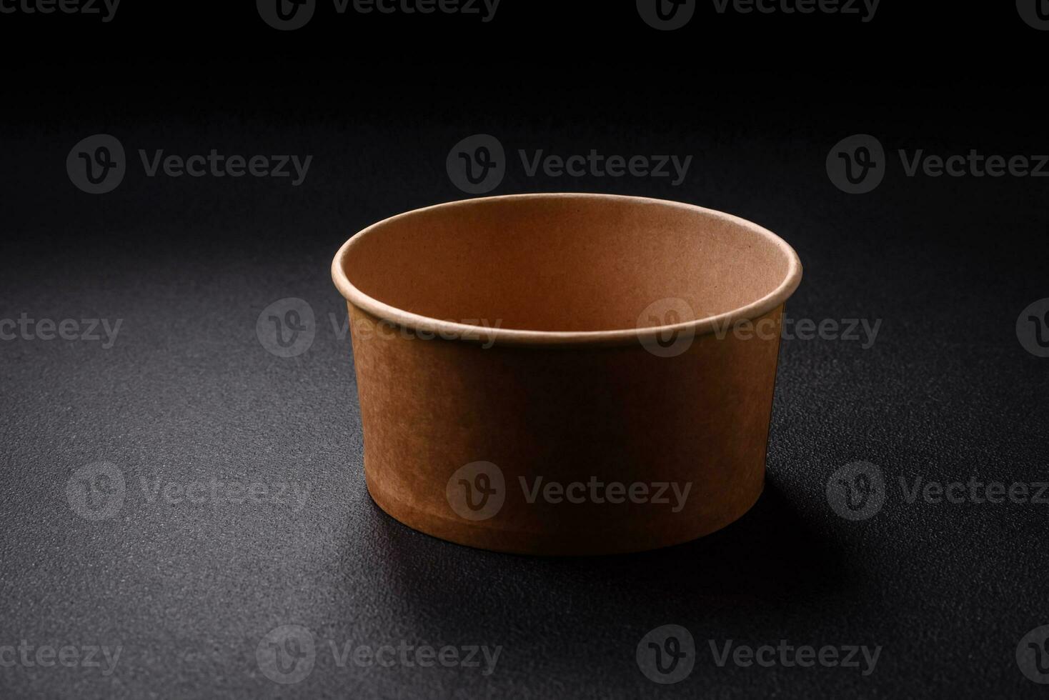 A cylindrical container made from environmentally friendly recycled materials for takeaway food photo