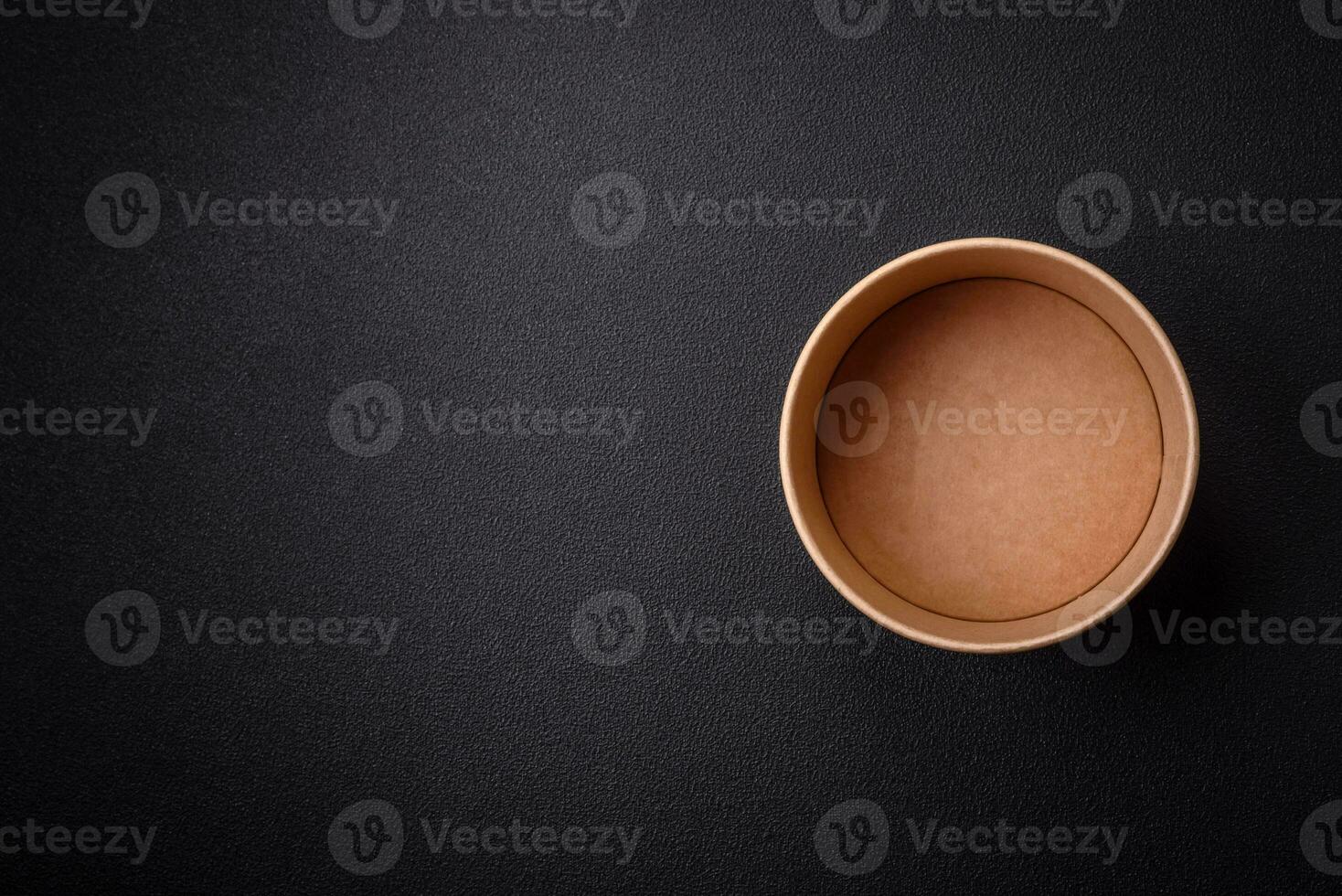 A cylindrical container made from environmentally friendly recycled materials for takeaway food photo