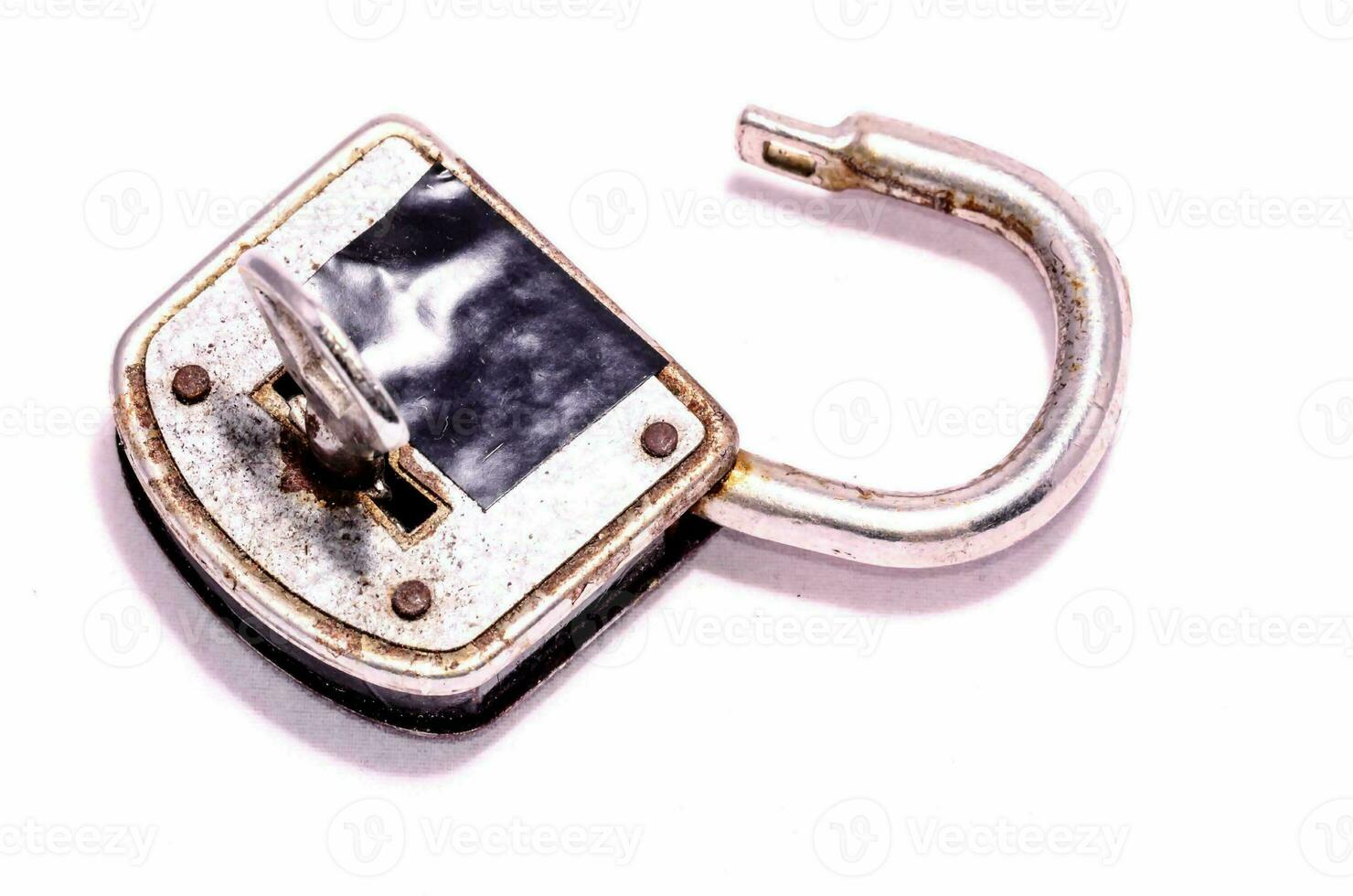 a metal padlock with a key on it photo