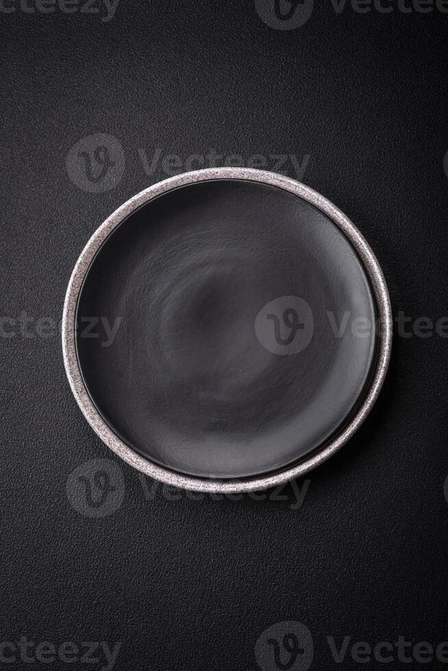 Empty round ceramic plate as an item of kitchen utensils photo