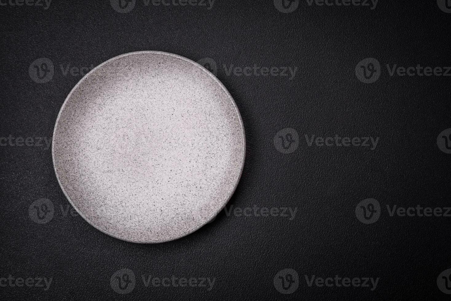 Empty round ceramic plate as an item of kitchen utensils photo