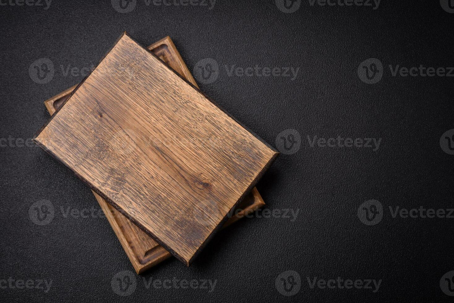 Empty wooden cutting board for preparing ingredients for preparing a delicious dish photo