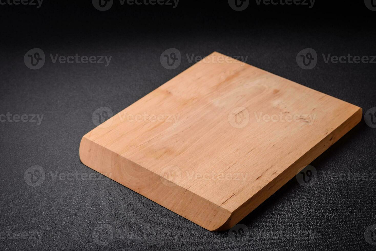 Empty wooden cutting board for preparing ingredients for preparing a delicious dish photo