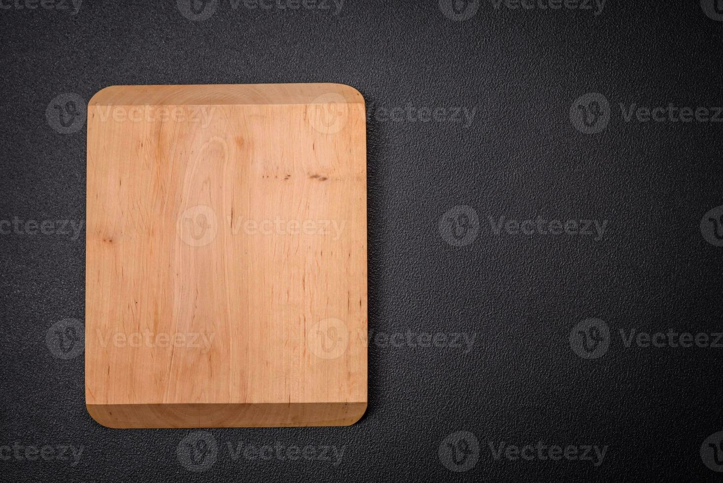 Empty wooden cutting board for preparing ingredients for preparing a delicious dish photo