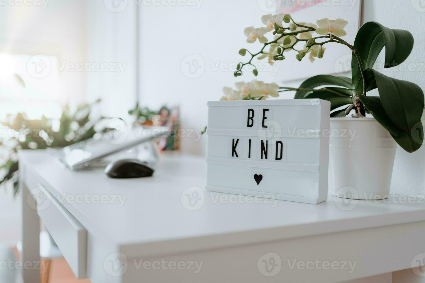 Modern sign at home written be kind photo