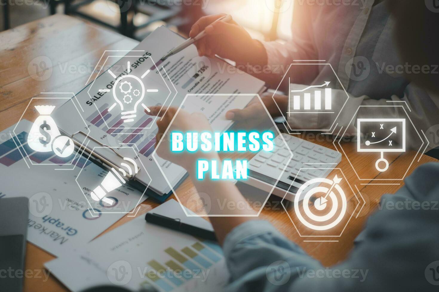 Business plan concept, Business team analyzing income charts and graphs on office desk with business plan icon on virtual screen. photo