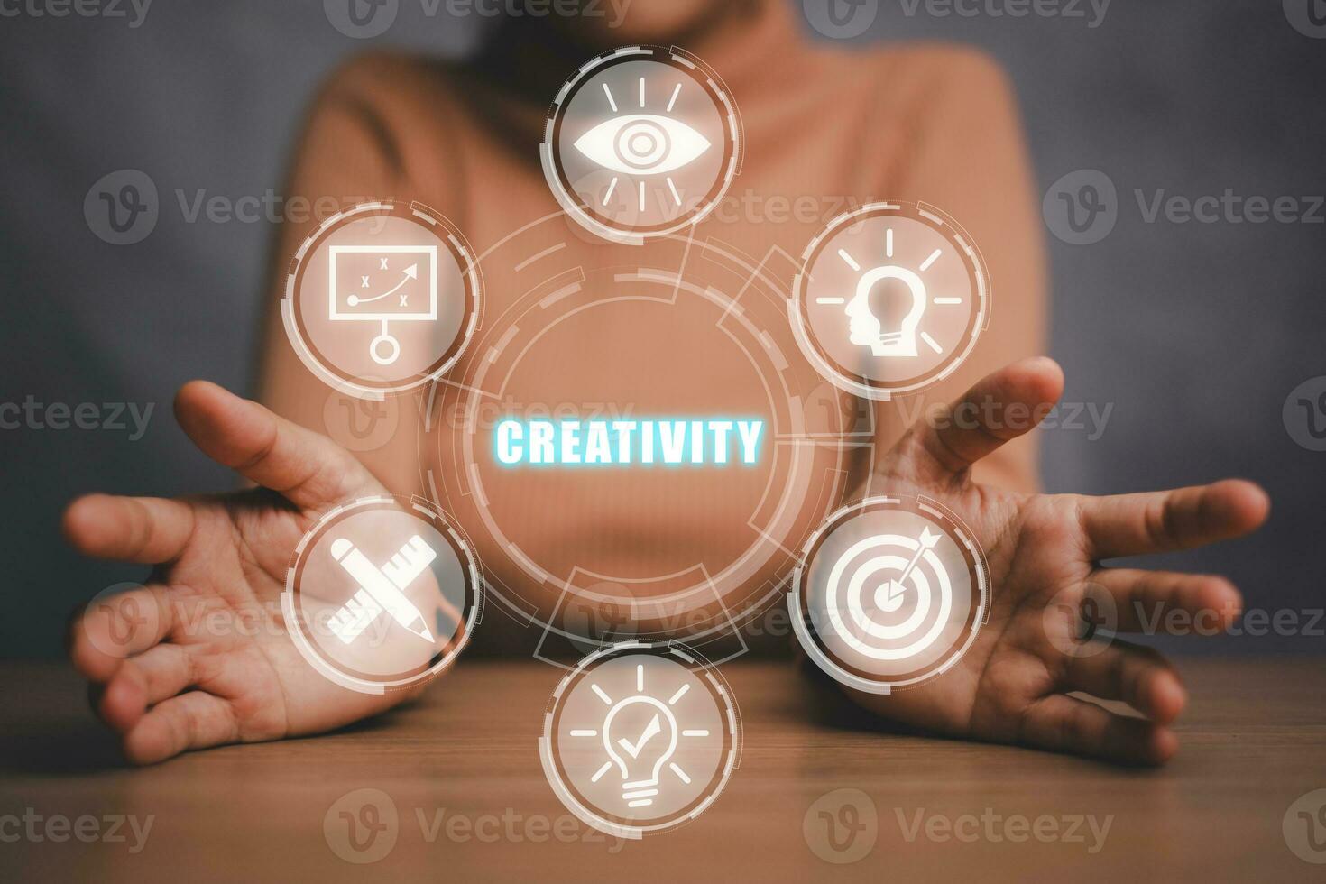 Creativity concept, Business person hand holding creativity icon on virtual screen. photo