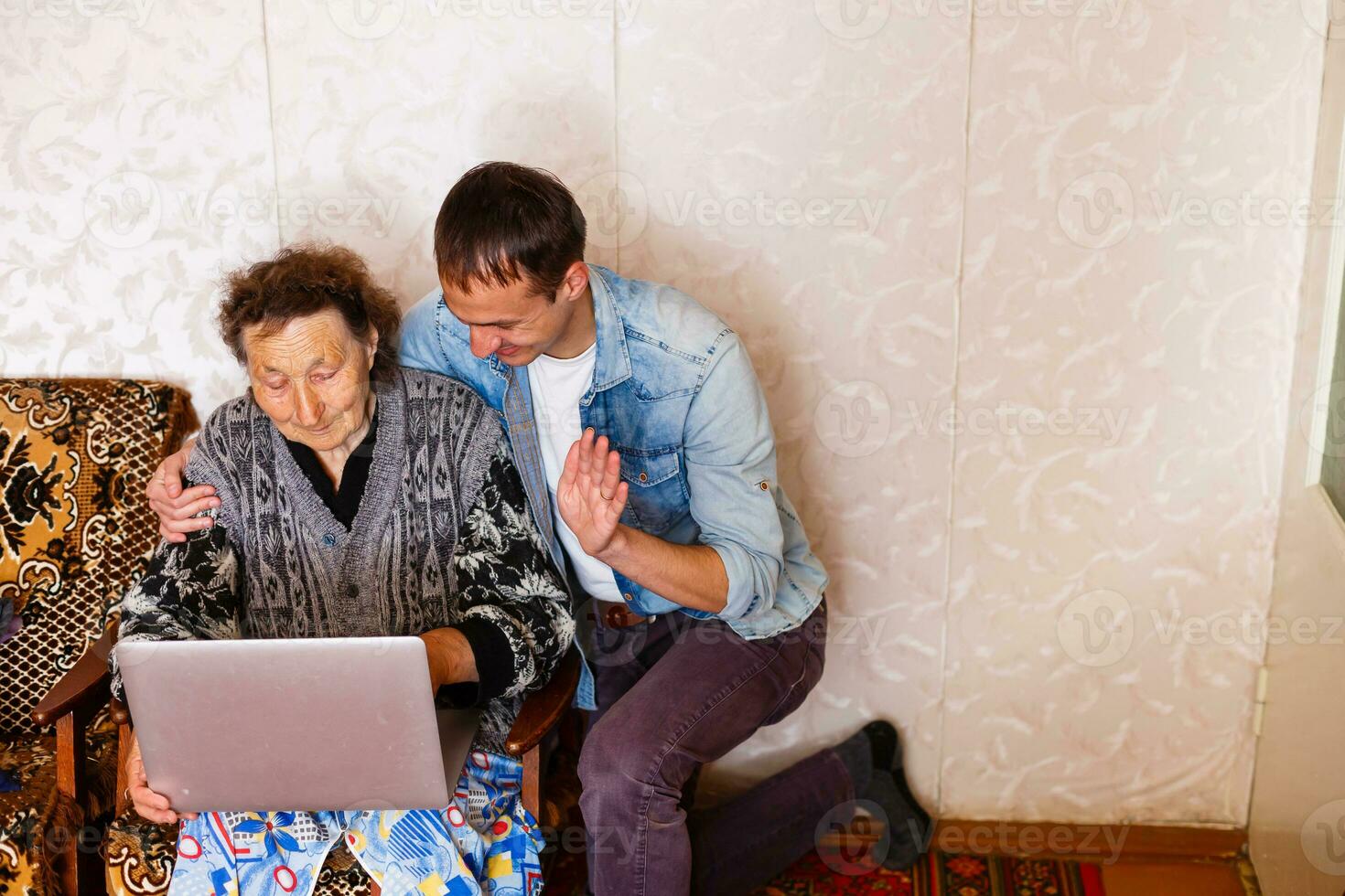 Closeup of elderly woman with young man photo