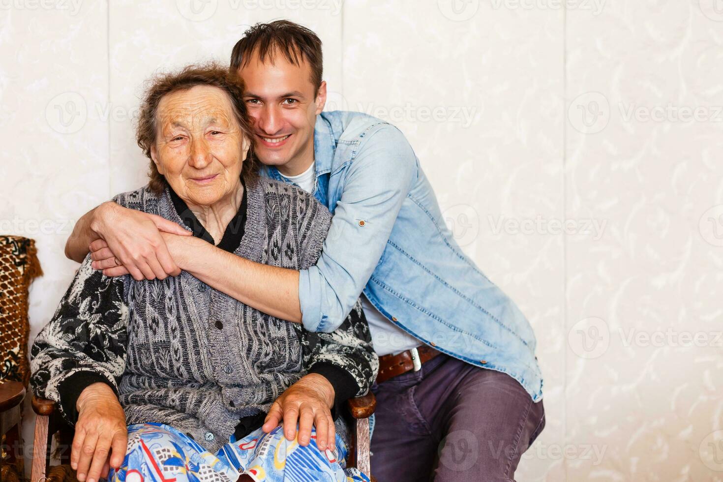 Closeup of elderly woman with young man photo