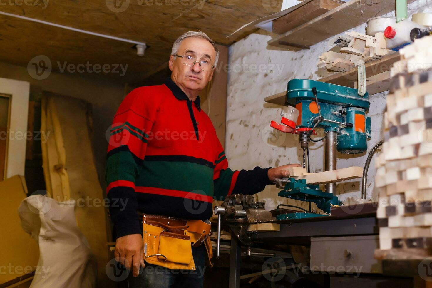 Image of mature carpenter in the workshop photo