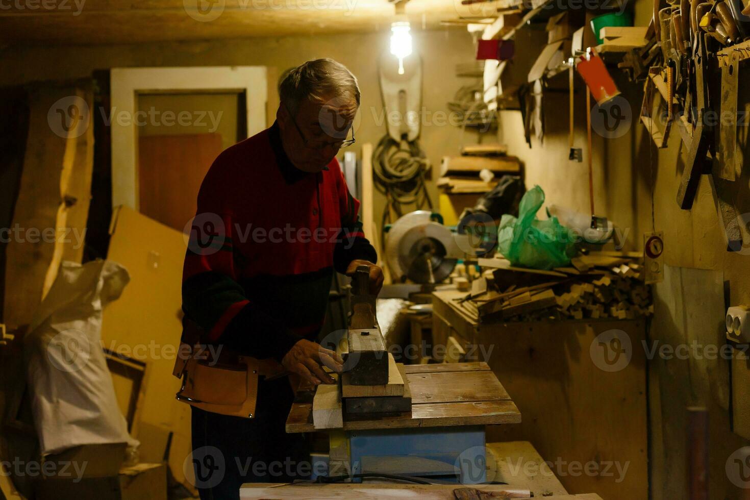 Image of mature carpenter in the workshop photo