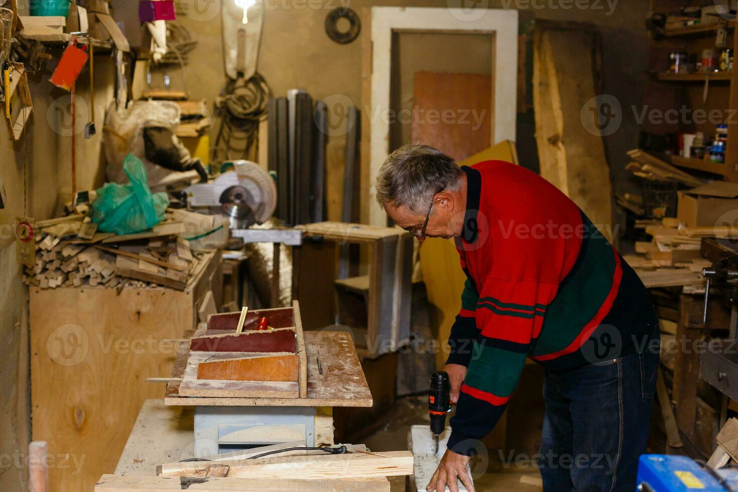 Image of mature carpenter in the workshop photo