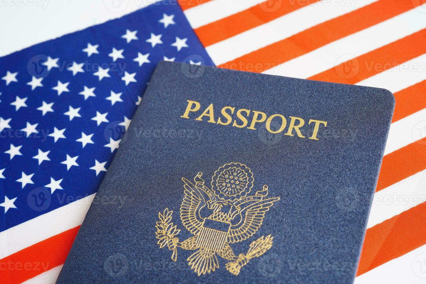 US passport on USA flag, American citizen in United States of America. photo