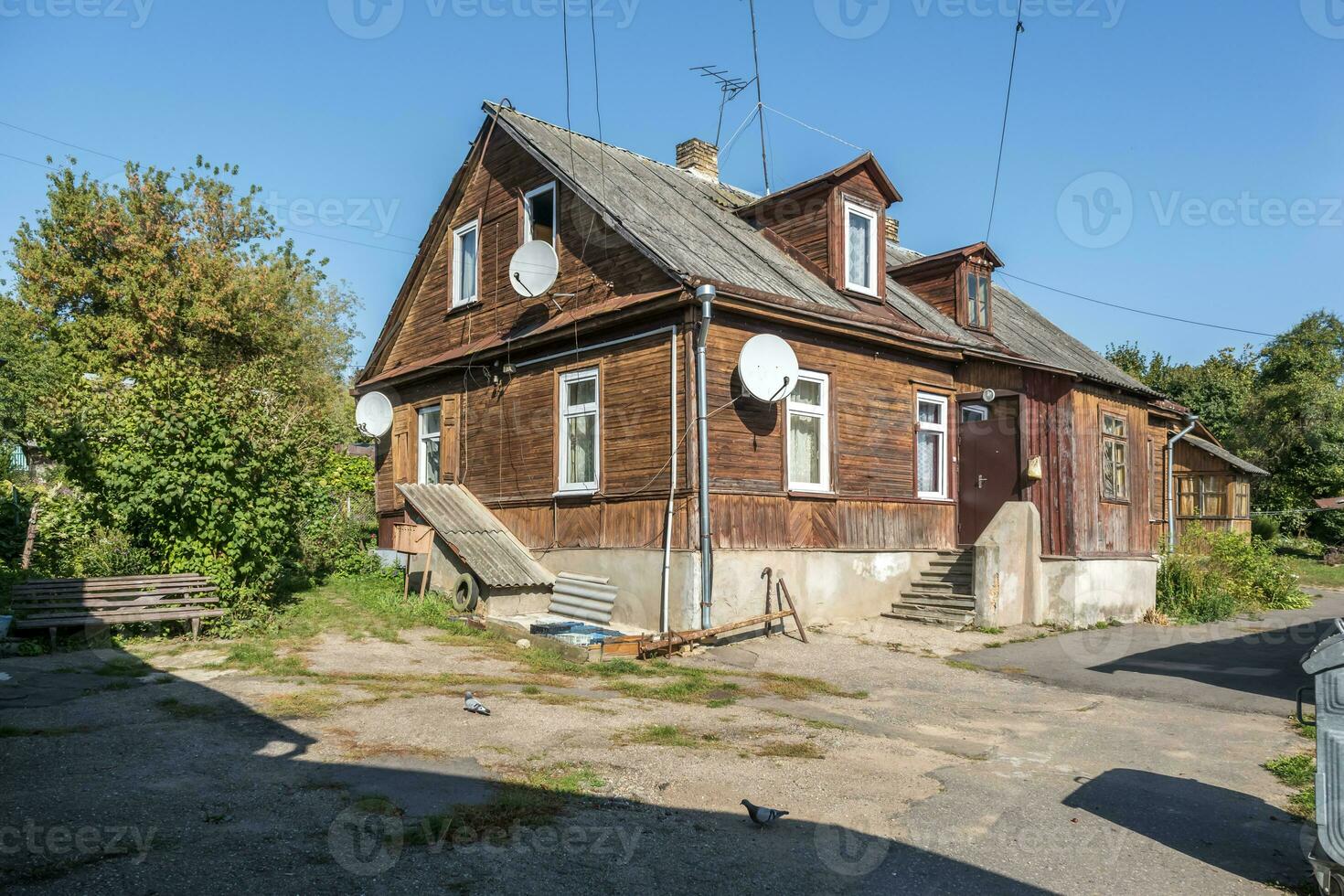 hundred-year-old historical old wooden building and homestead of private sector in wooden constructivism style photo