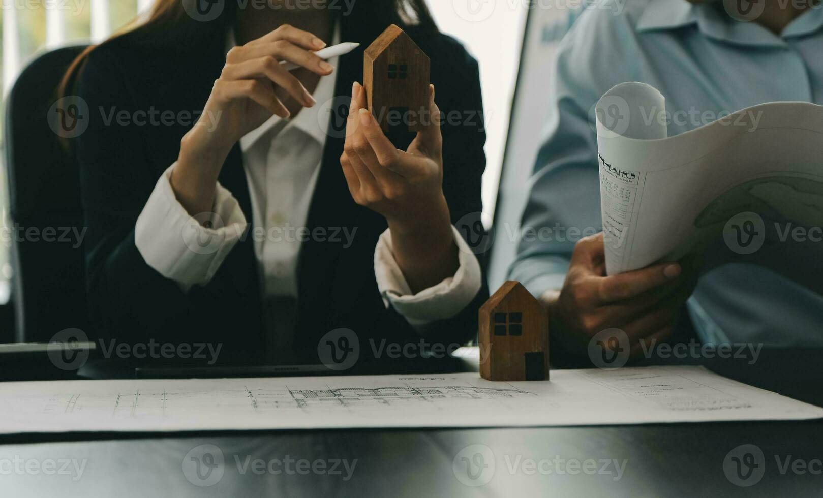 Construction and structure concept of Engineer or architect meeting for project working with partner and engineering tools on model building and blueprint in working site, contract for both companies. photo