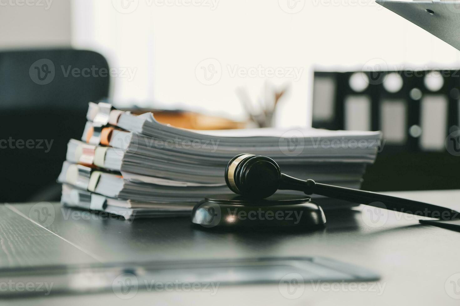 Business and lawyers discussing contract papers with brass scale on desk in office. Law, legal services, advice, justice and law concept picture with film grain effect photo