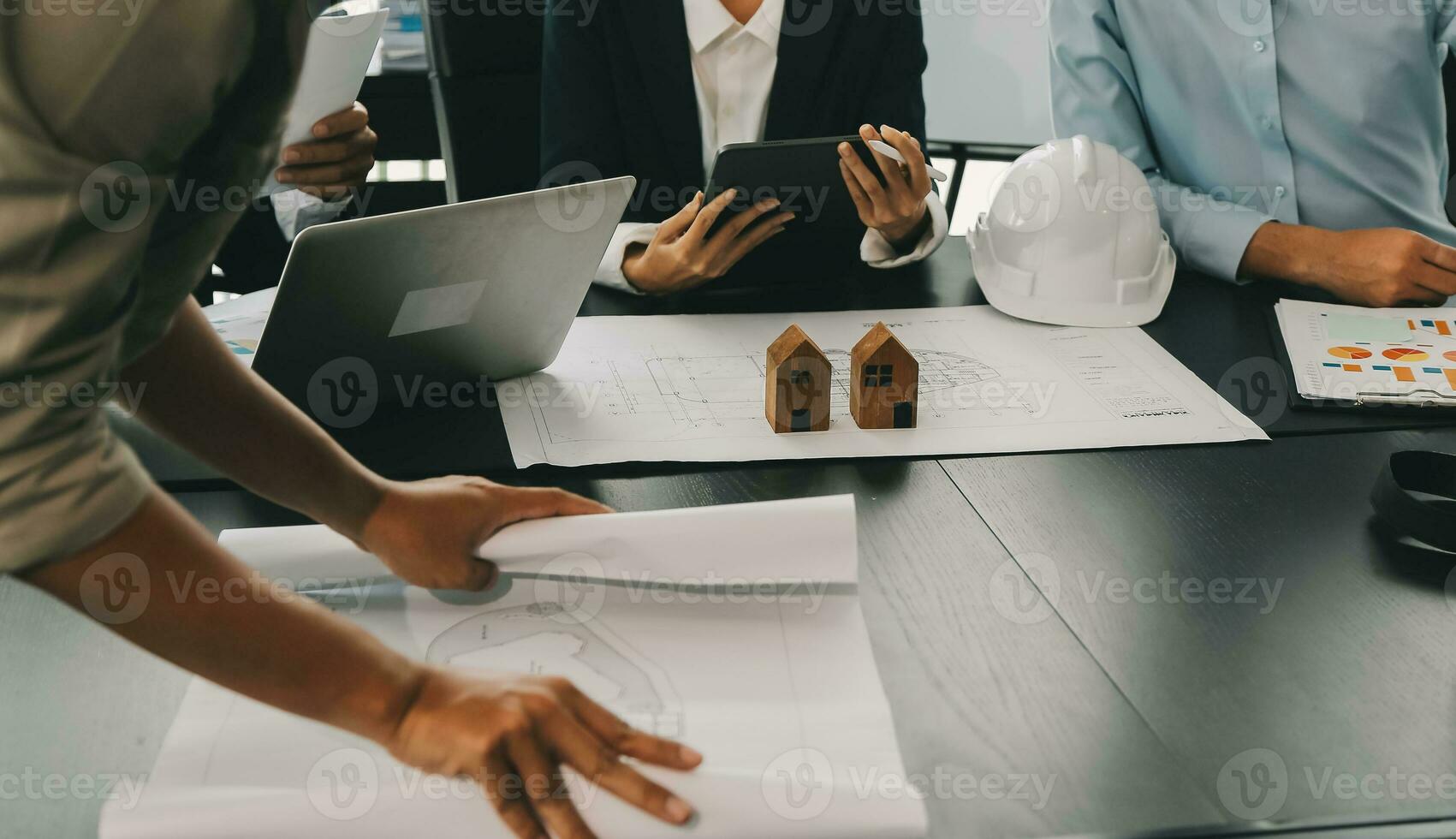 Construction and structure concept of Engineer or architect meeting for project working with partner and engineering tools on model building and blueprint in working site, contract for both companies. photo