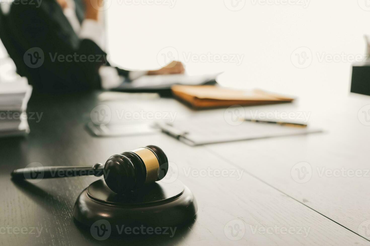 Consultation and conference of Male lawyers and professional businesswoman working and discussion having at law firm in office. Concepts of law, Judge gavel with scales of justice. photo