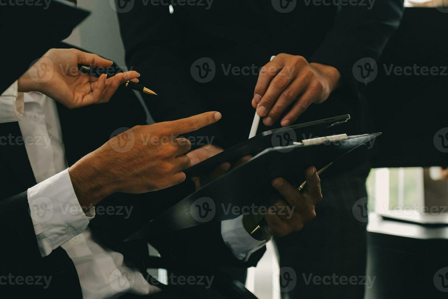 Business team working with new startup project plan and discussion information for financial strategy with laptop and digital tablet in a modern business lounge. photo