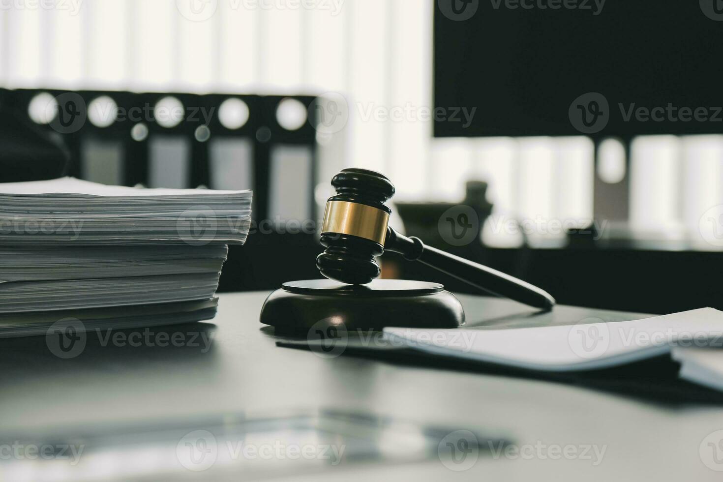 Business and lawyers discussing contract papers with brass scale on desk in office. Law, legal services, advice, justice and law concept picture with film grain effect photo