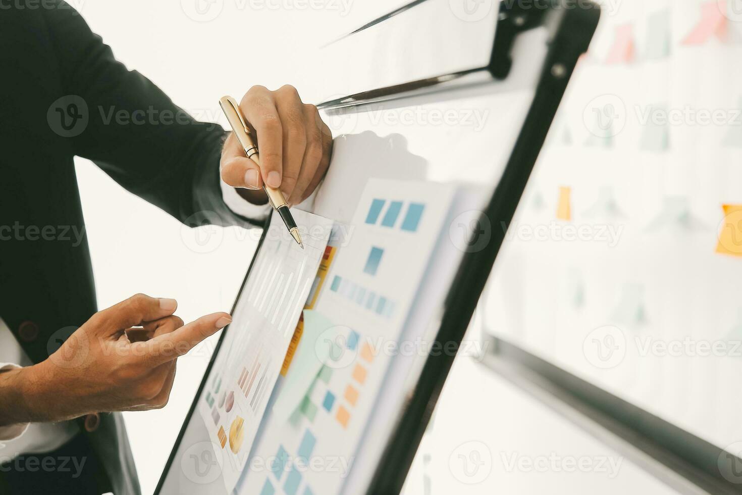 Business team working with new startup project plan and discussion information for financial strategy with laptop and digital tablet in a modern business lounge. photo