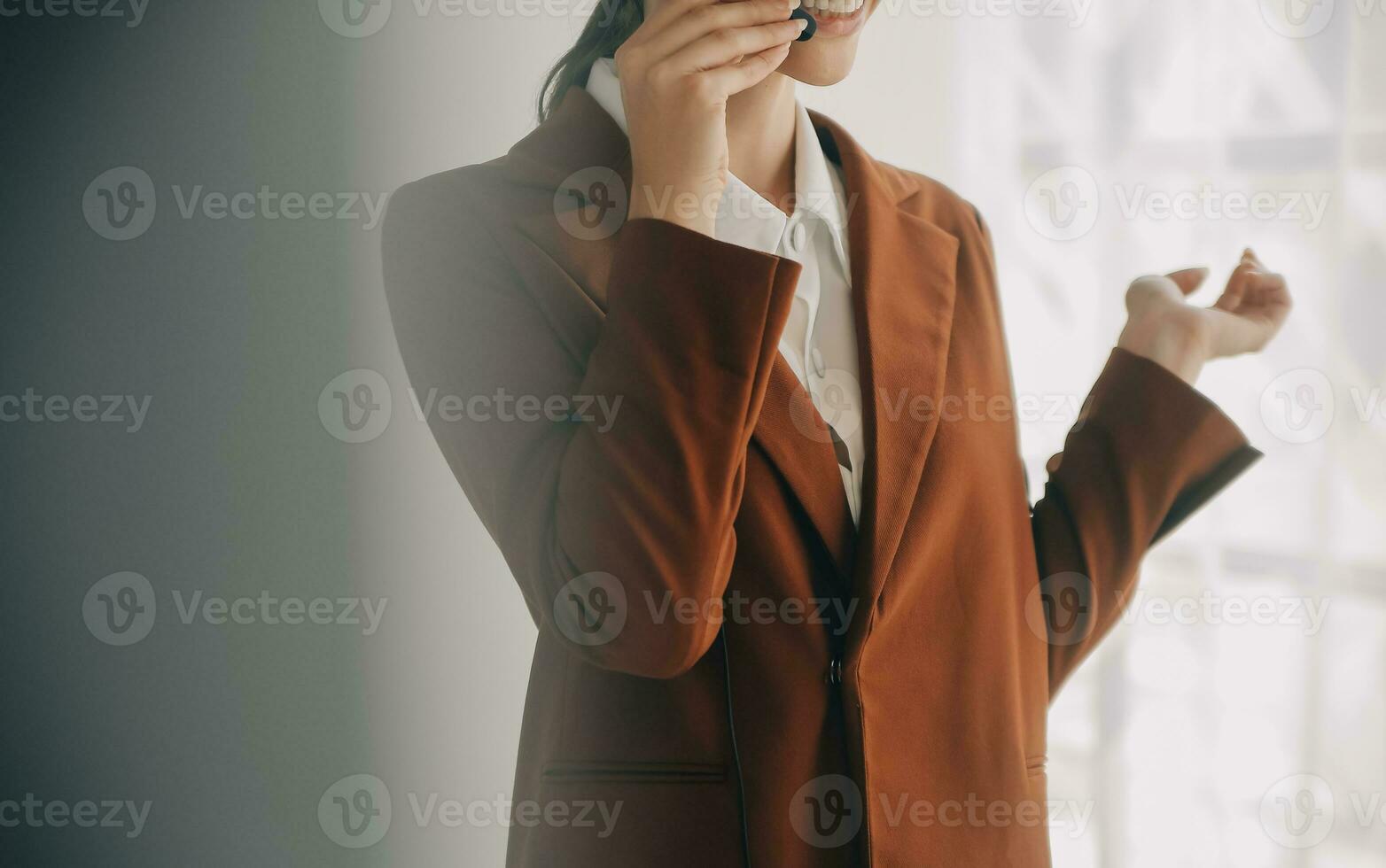 Beautiful female call center operator working on computer in office photo