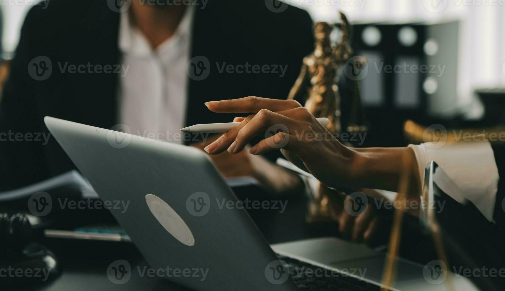 Business and lawyers discussing contract papers with brass scale on desk in office. Law, legal services, advice, justice and law concept picture with film grain effect photo