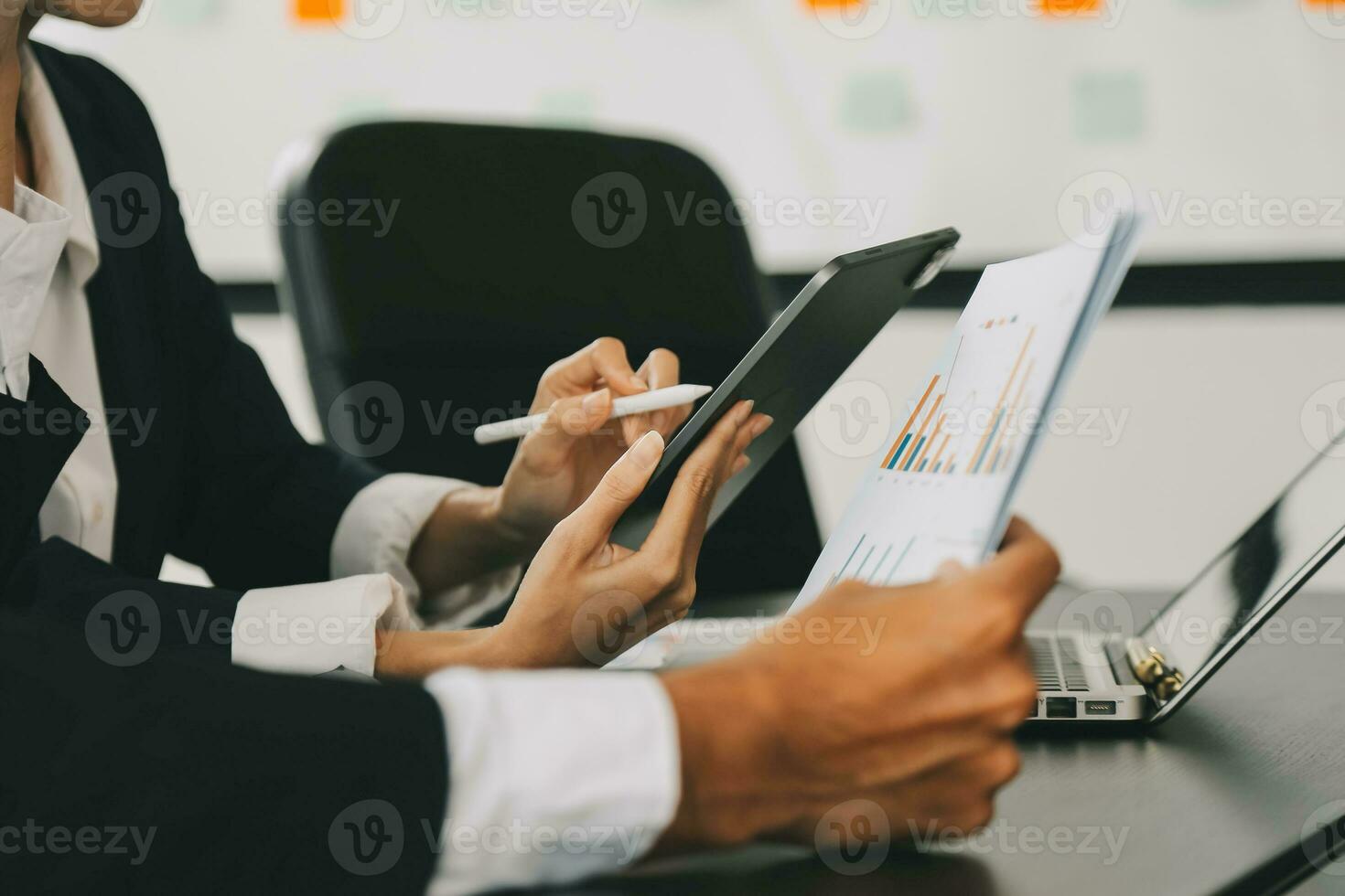 Close up of Business team analyzing income charts and graphs with modern laptop computer. Business analysis and strategy concept. photo