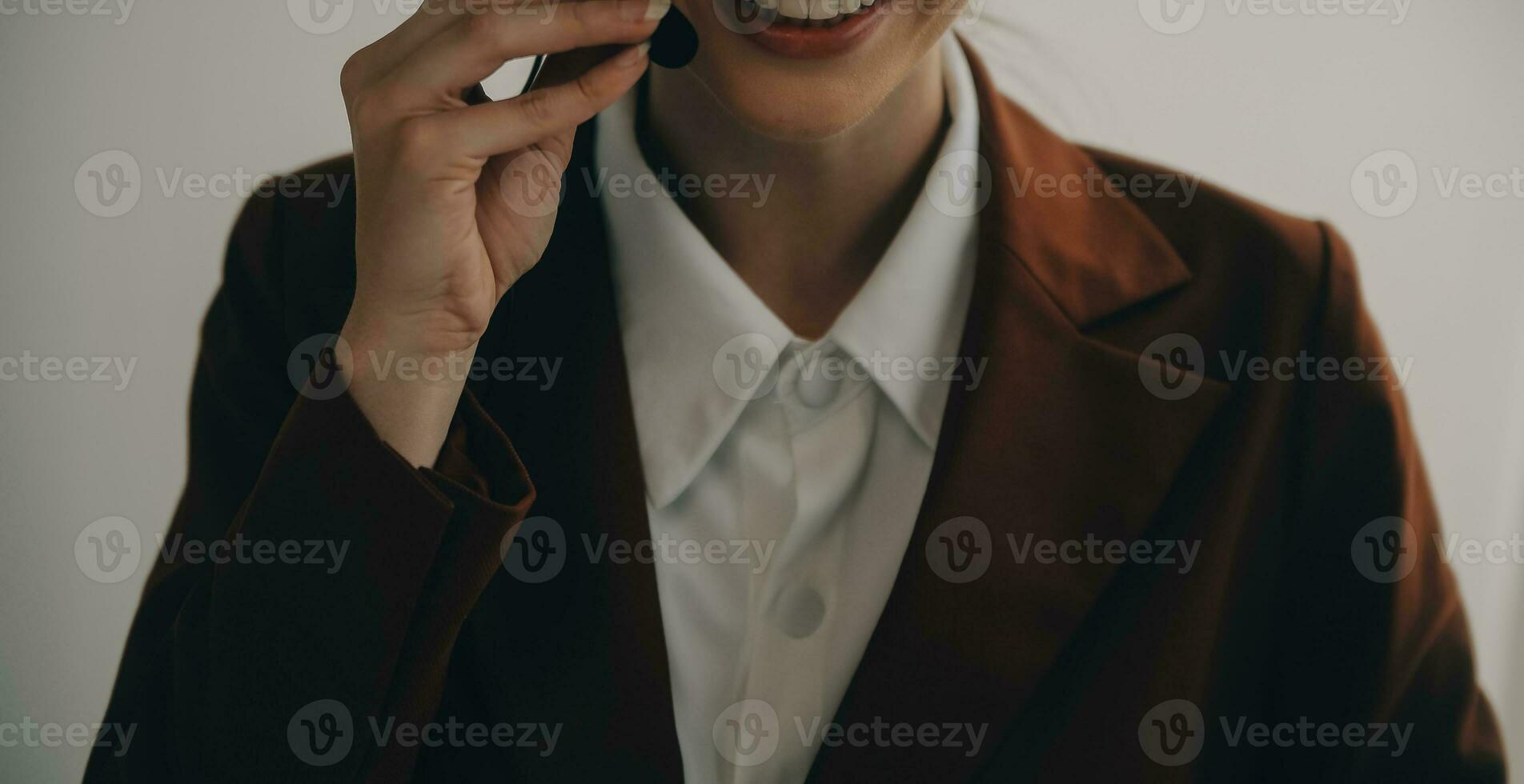 Beautiful female call center operator working on computer in office photo