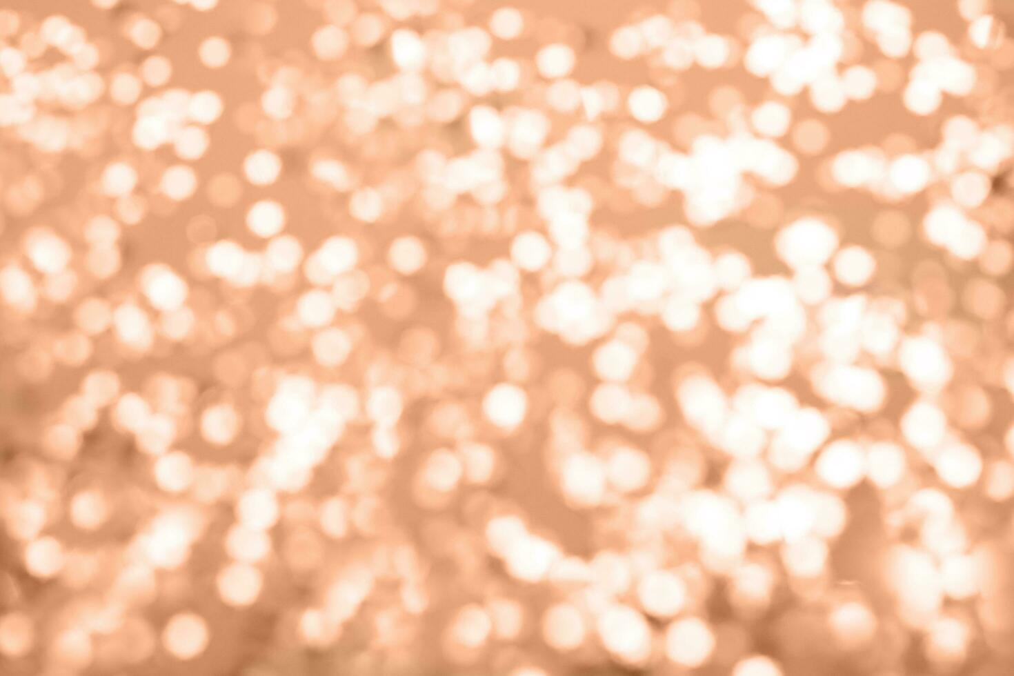 Peach Fuzz sparkles on a purple background. Festive backdrop for your projects. photo