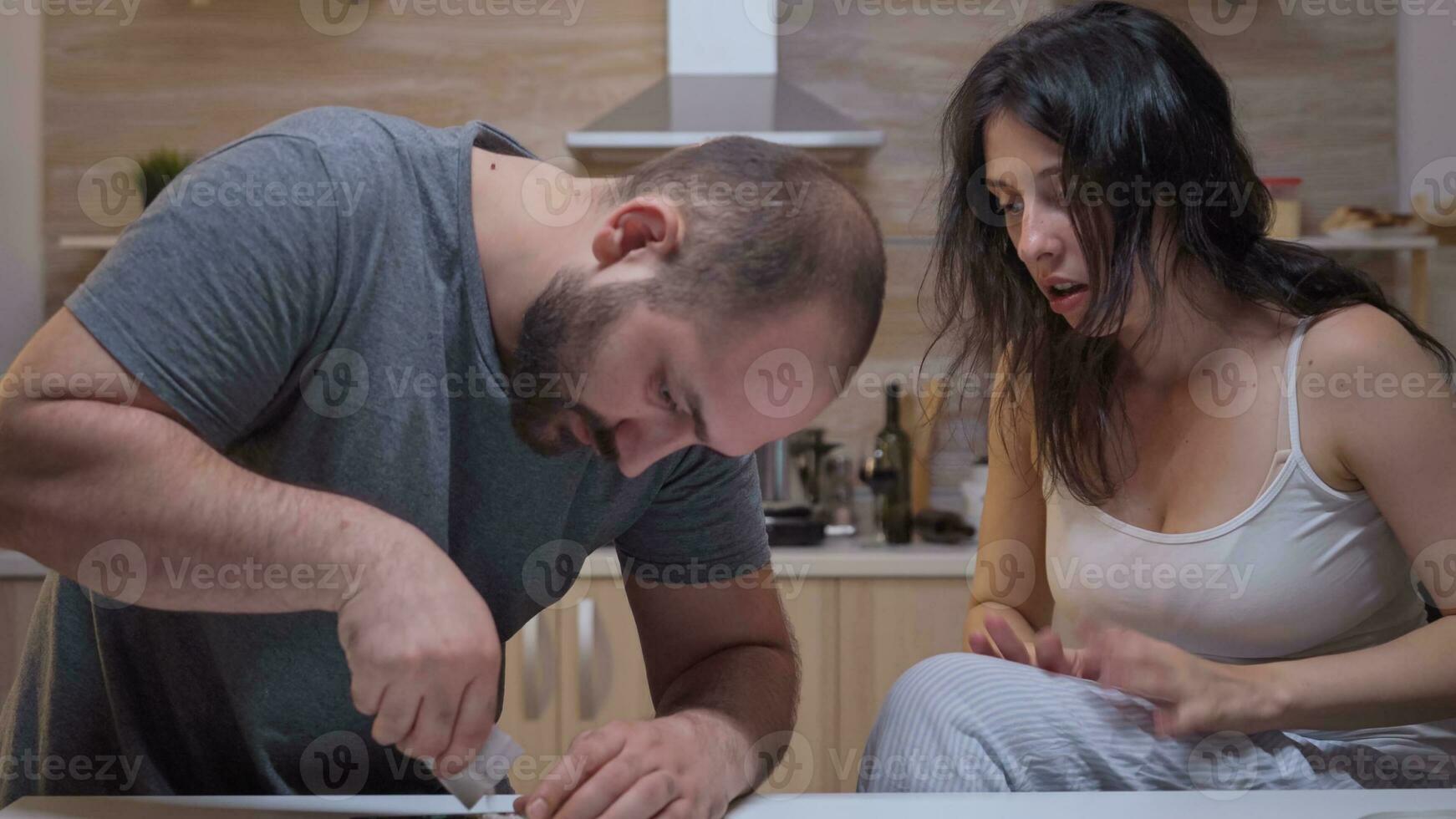 Man preparing cocaine lines on the table. Persons using to heroin, cocaine, amphetamine abuse with side effects suffers from pain making seizures, social disaster and narcotics addiction epidemic. photo