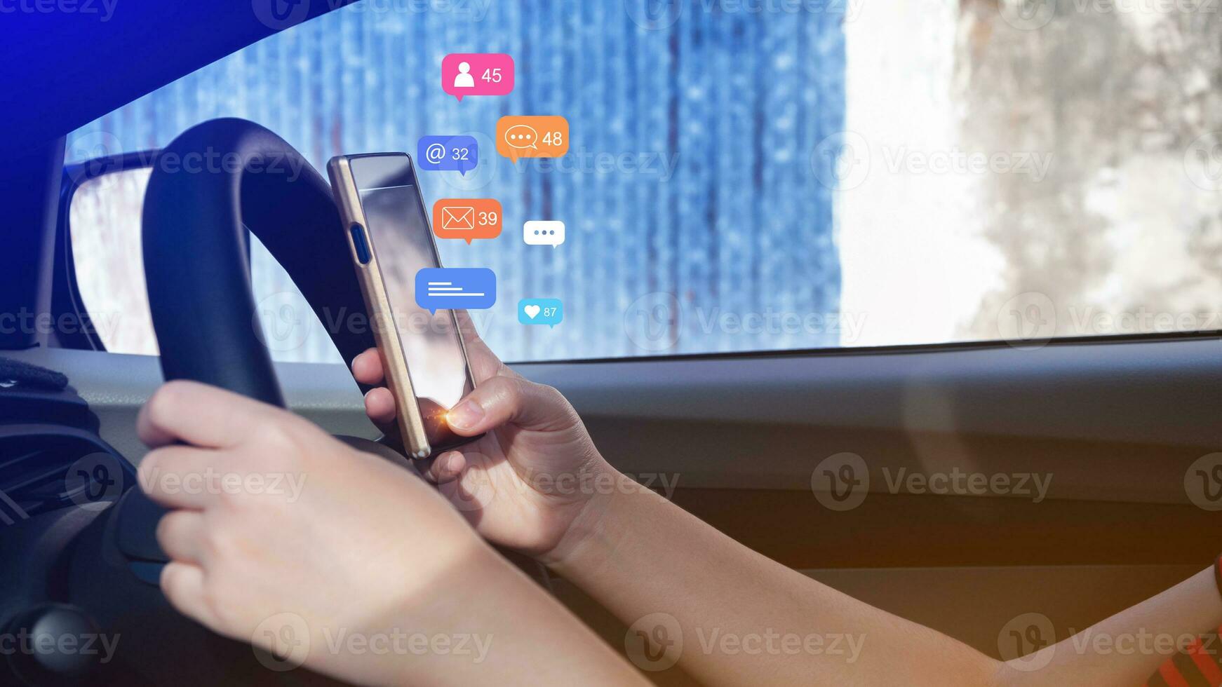 Woman using social media and digital online marketing concepts on mobile phones with icons such as notifications, messages, comments on the smartphone screen in car. photo