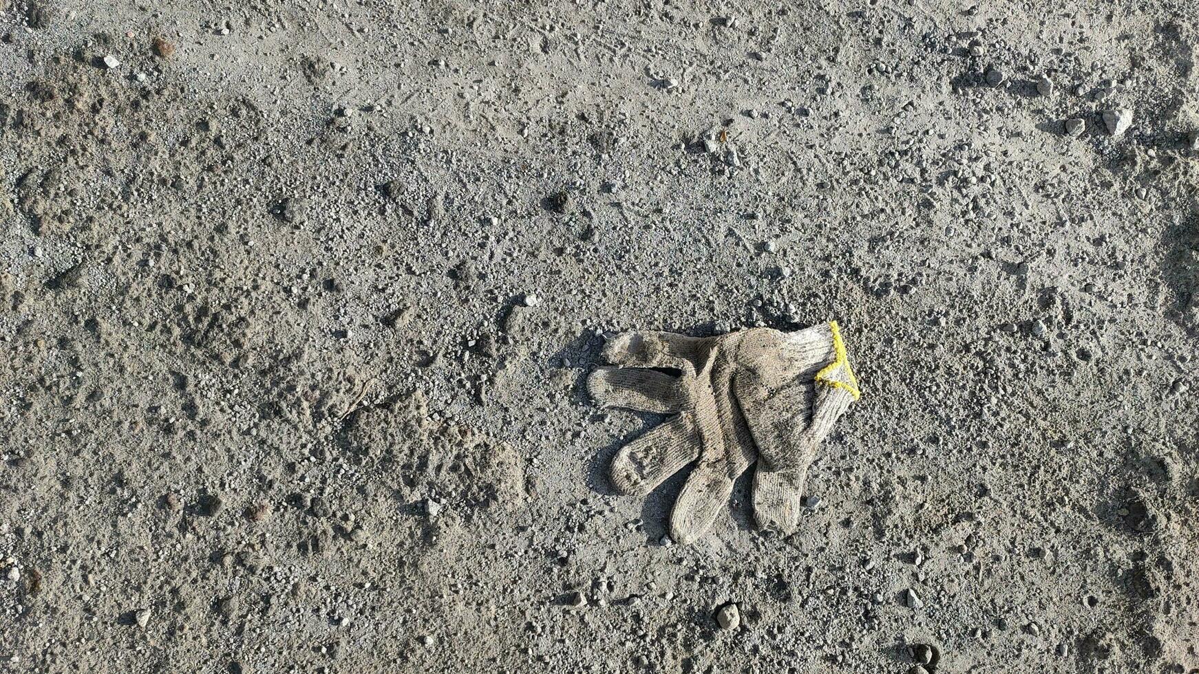 Gloves used, lying on the ground photo