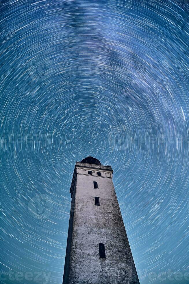 Rotating stars above Rubjerg Knude Fyr in northern Denmark photo