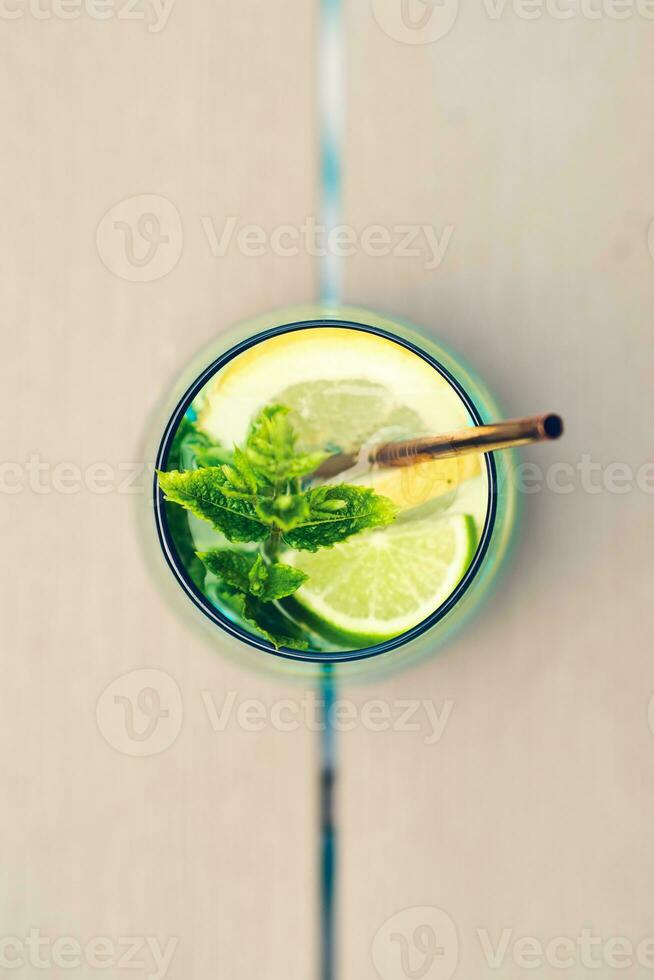Cold beverage with lime and citrus photo
