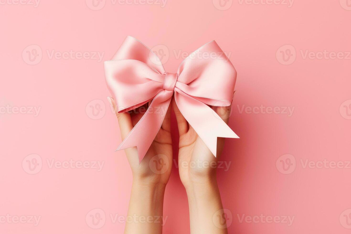 AI generated Hands catching a pink bow on a pink background, cancer day, AI Generative photo