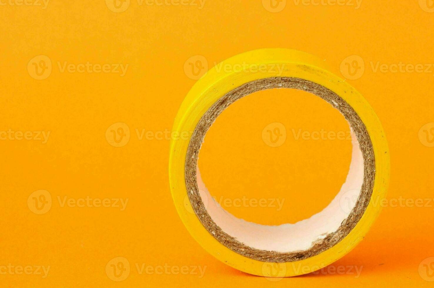 a tape roll on an orange background photo