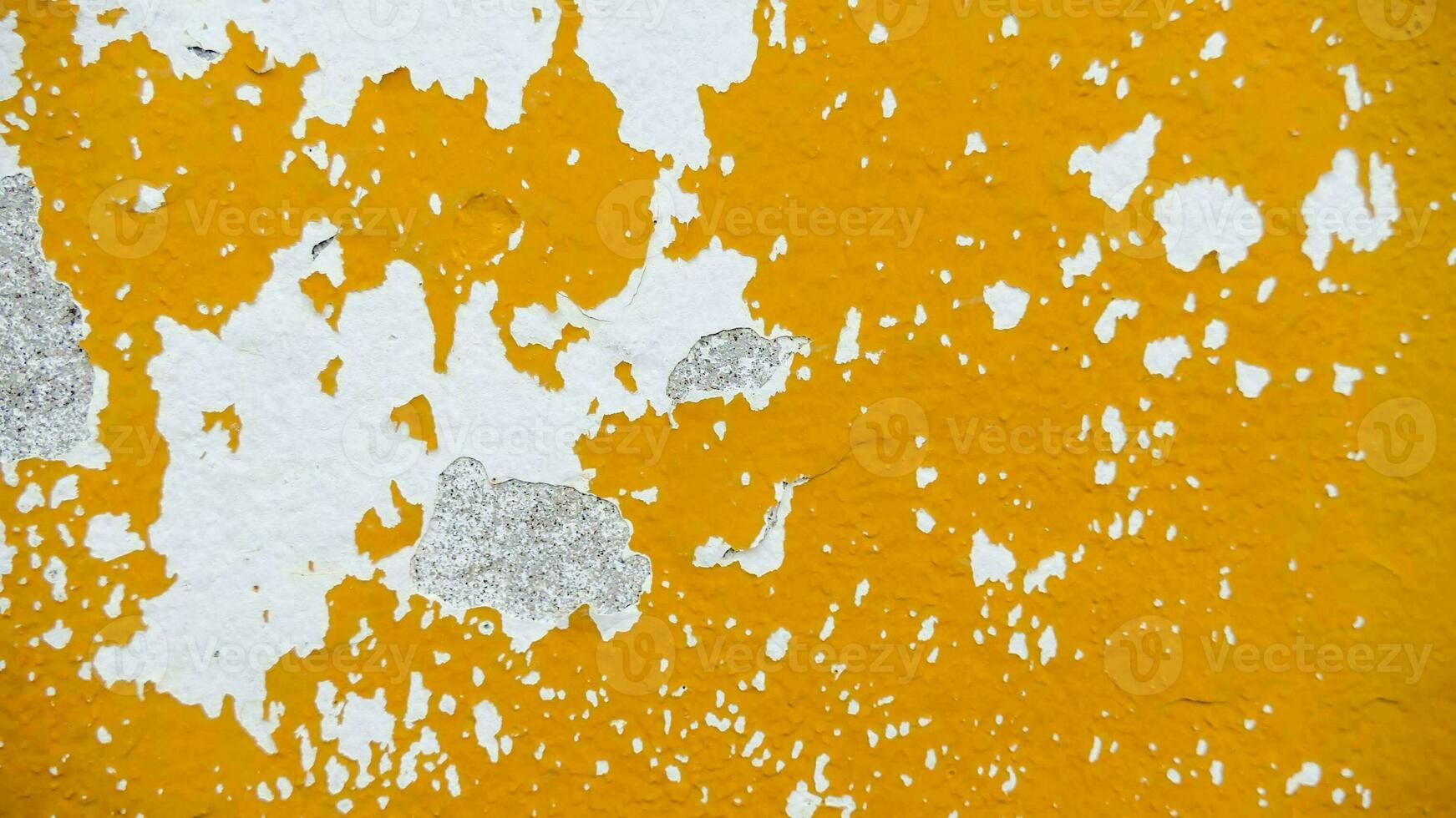 a close up of a yellow painted wall photo