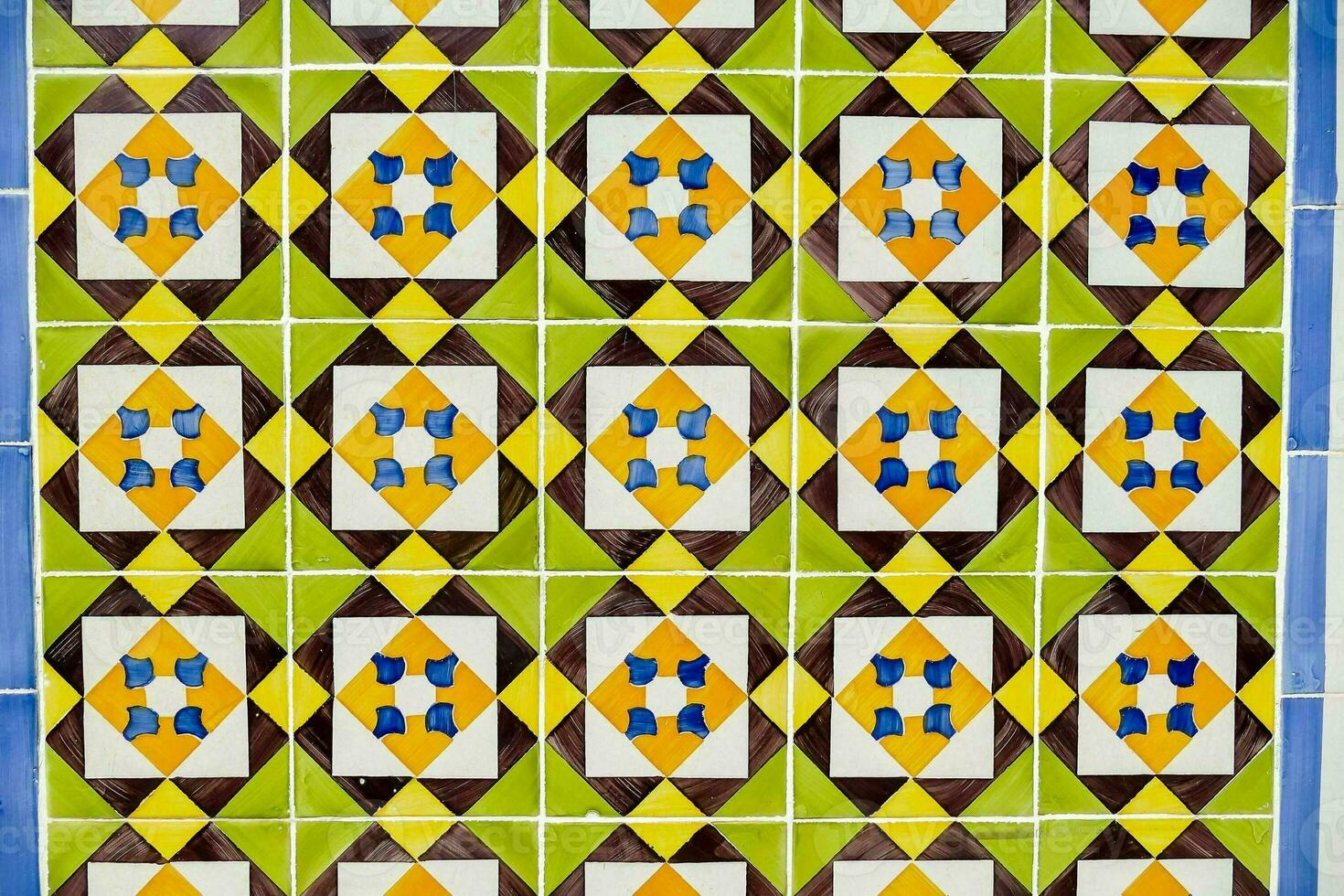 a colorful tile wall with geometric designs photo