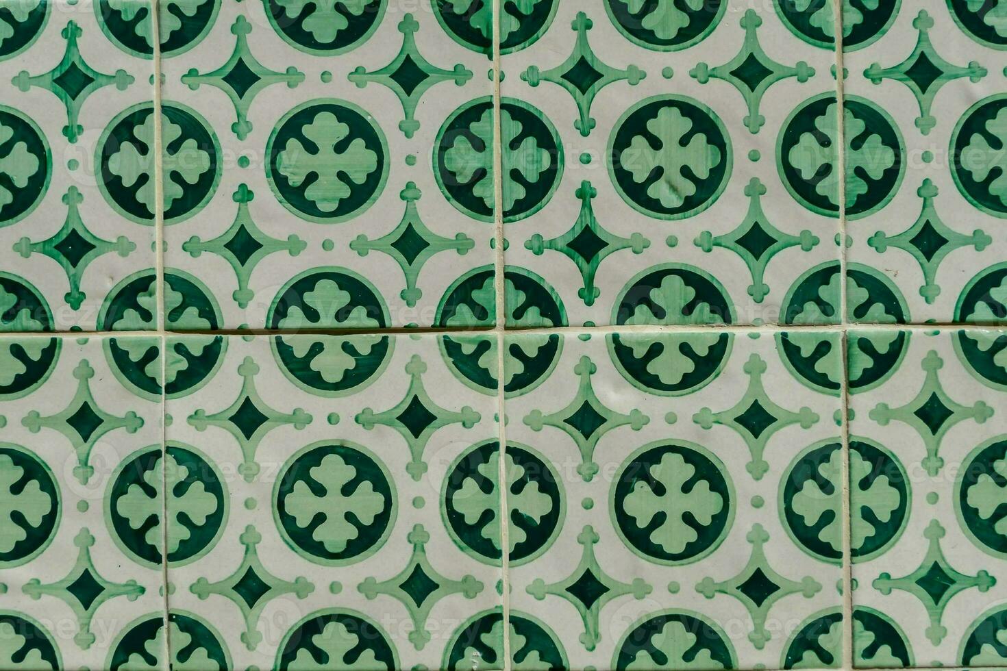 a colorful tile pattern with blue, green and red flowers photo