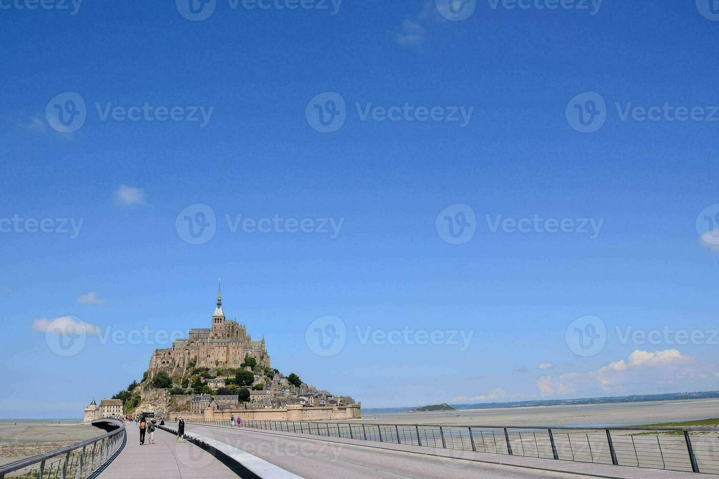 a walkway leads to the mont saint michel photo