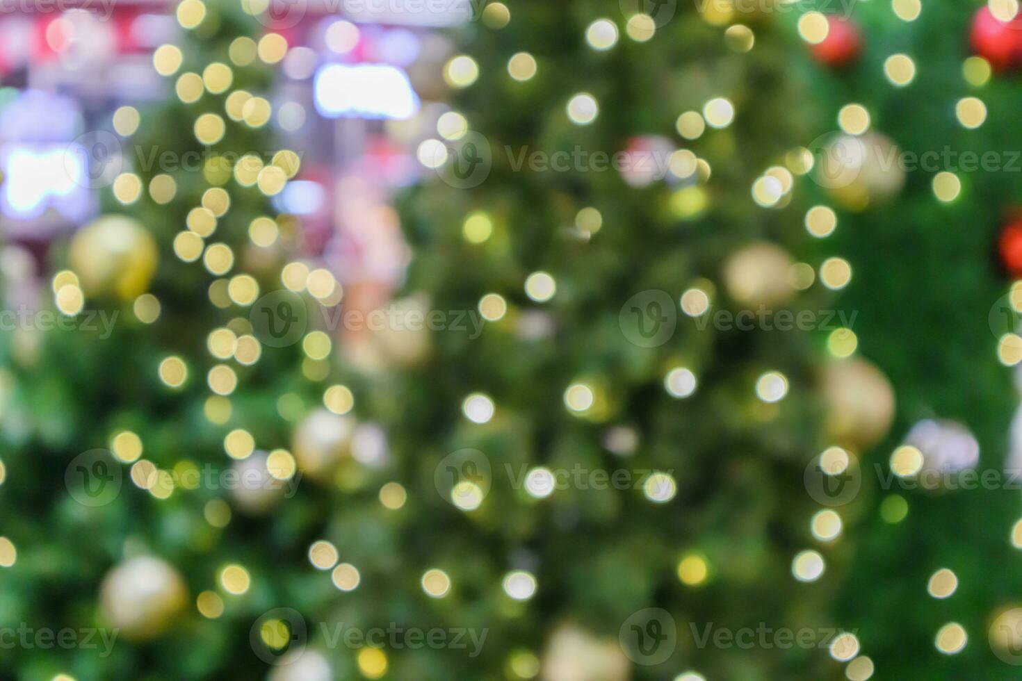 Abstract blurred christmas tree with bokeh light background photo