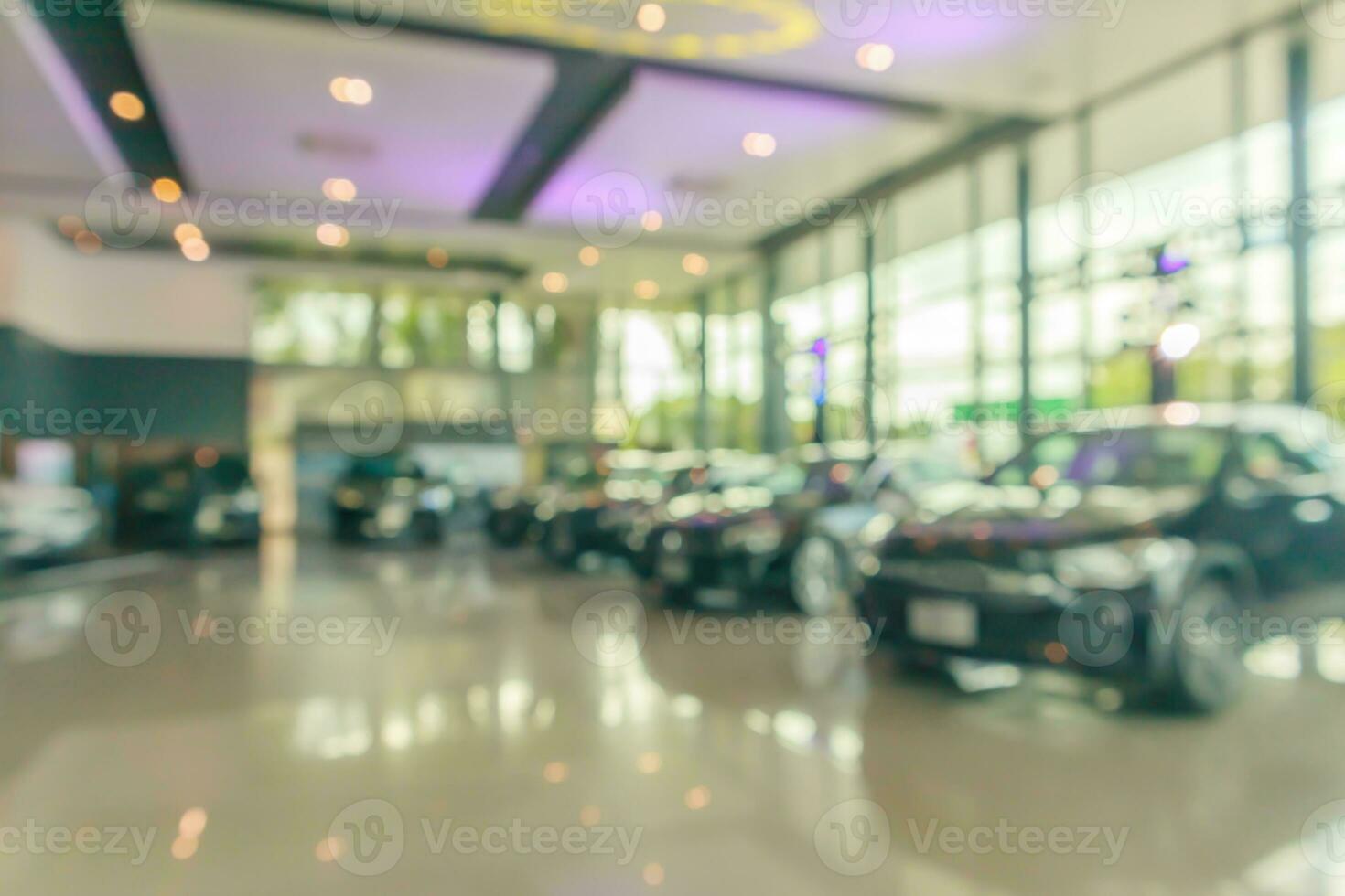 new cars in showroom interior blurred abstract background photo