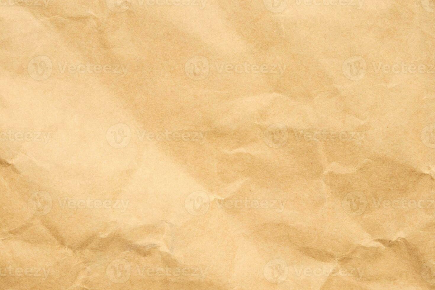 Abstract crumpled and creased recycle brown paper texture background photo