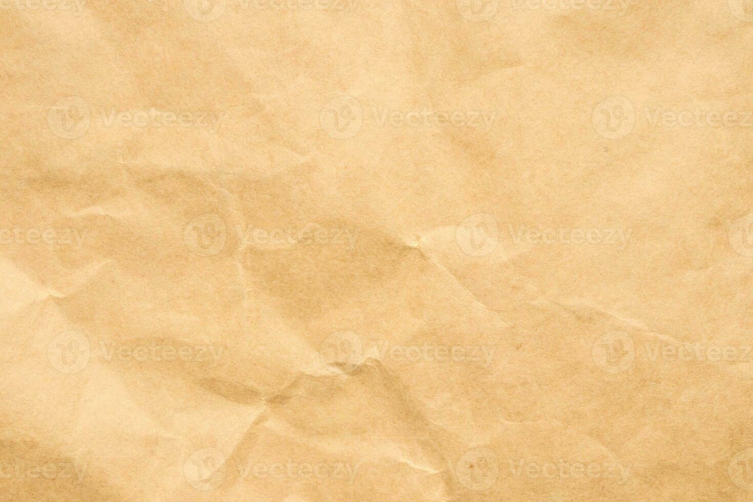 Abstract crumpled and creased recycle brown paper texture background photo